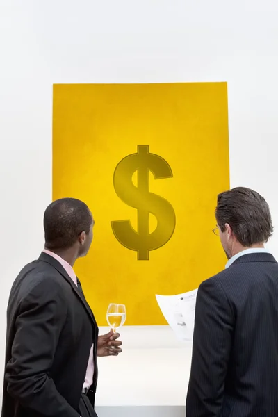 Male executive looking at Dollar sign — Stock Photo, Image