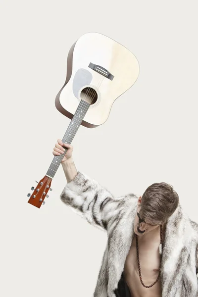 Frustrated man throw his guitar — Stock Photo, Image