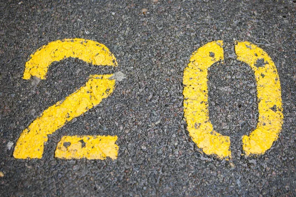 Numerical 20 painted in car park — Stock Photo, Image