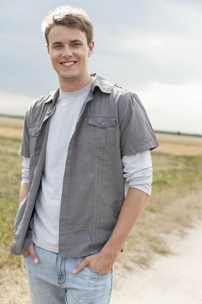 Man with hands in pockets — Stock Photo, Image