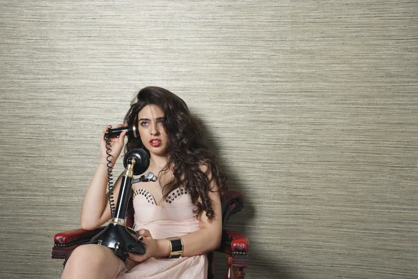 Attractive woman using nostalgic telephone — Stock Photo, Image