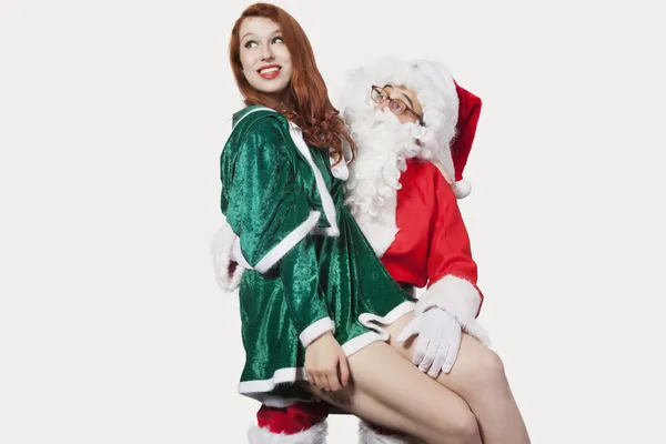 Noel Baba'nın kucağa oturan kadın — Stok fotoğraf