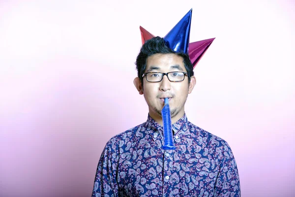 Man wearing many party hats — Stock Photo, Image