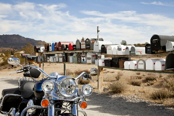 Motorcycle in front of rural mailboxes — Stock Photo, Image