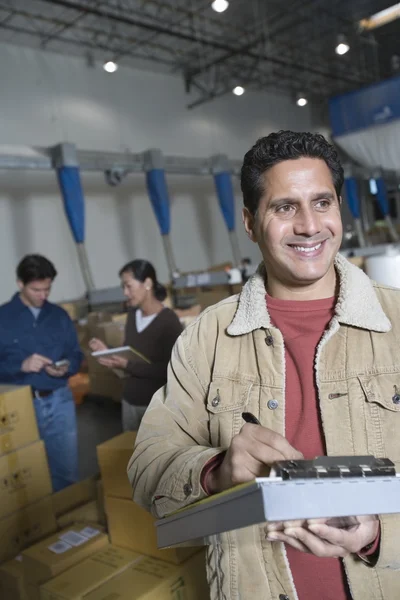 Man in distribution warehouse — Stock Photo, Image