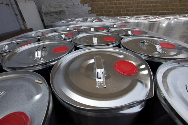 Tins outside warehouse — Stock Photo, Image