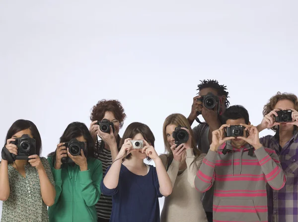 People making photo straight at camera — Stock Photo, Image