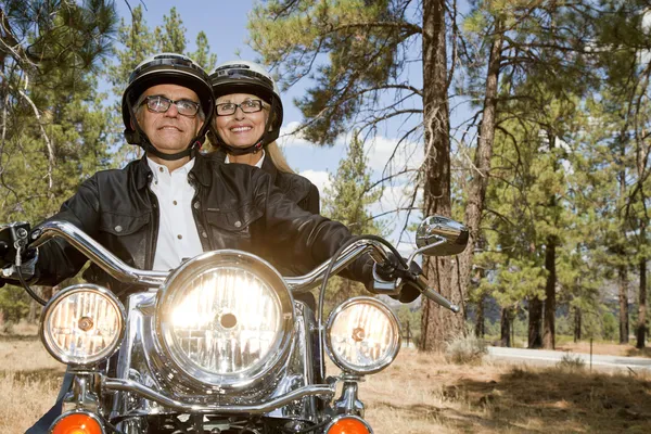 Senior couple riding motorcycle — Stock Photo, Image