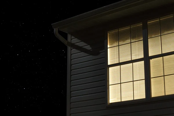 Lit window of building exterior — Stock Photo, Image