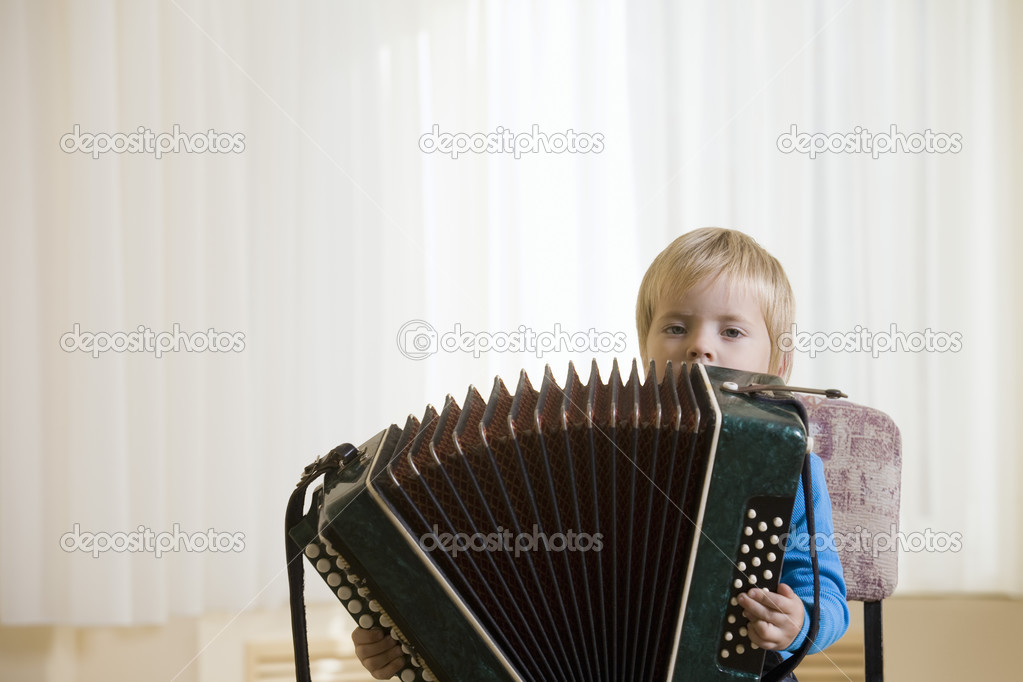 Boy playing accordion