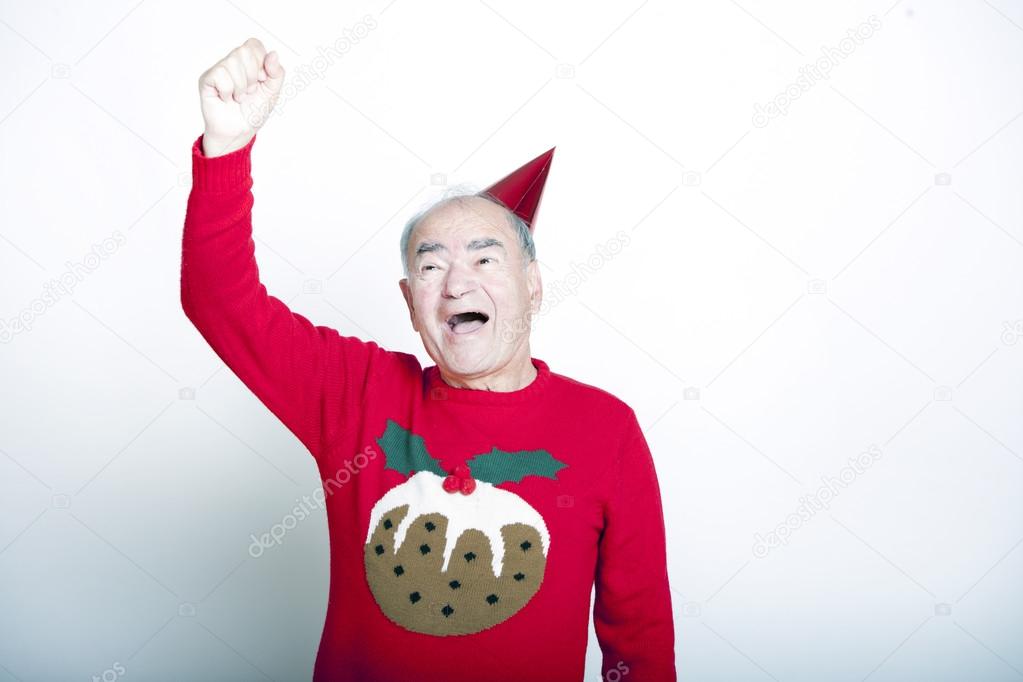 Senior man wearing Christmas jumper