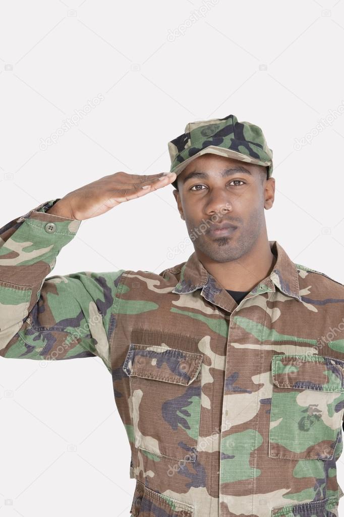 African American US Marine Corps soldier saluting
