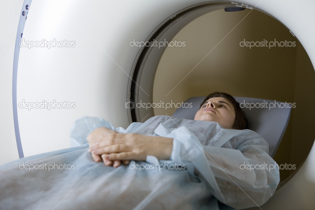 Woman in CAT scan machine