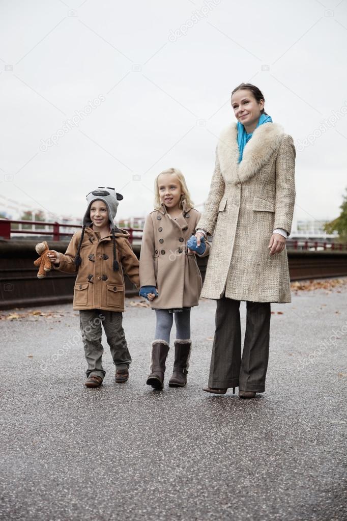 Young woman with children  on street