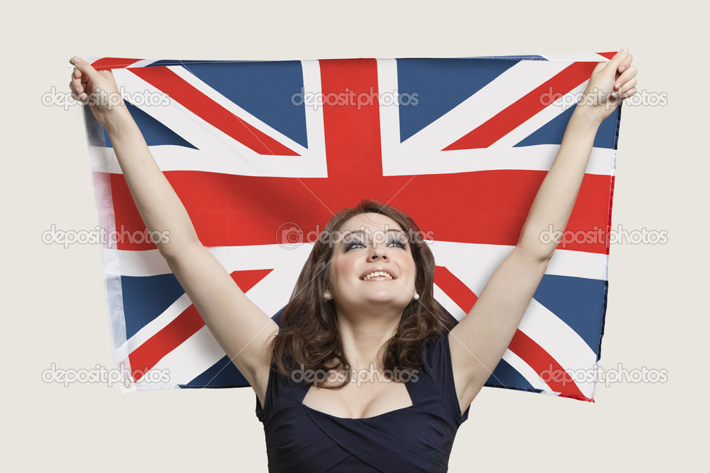 Woman holding British Flag with pride