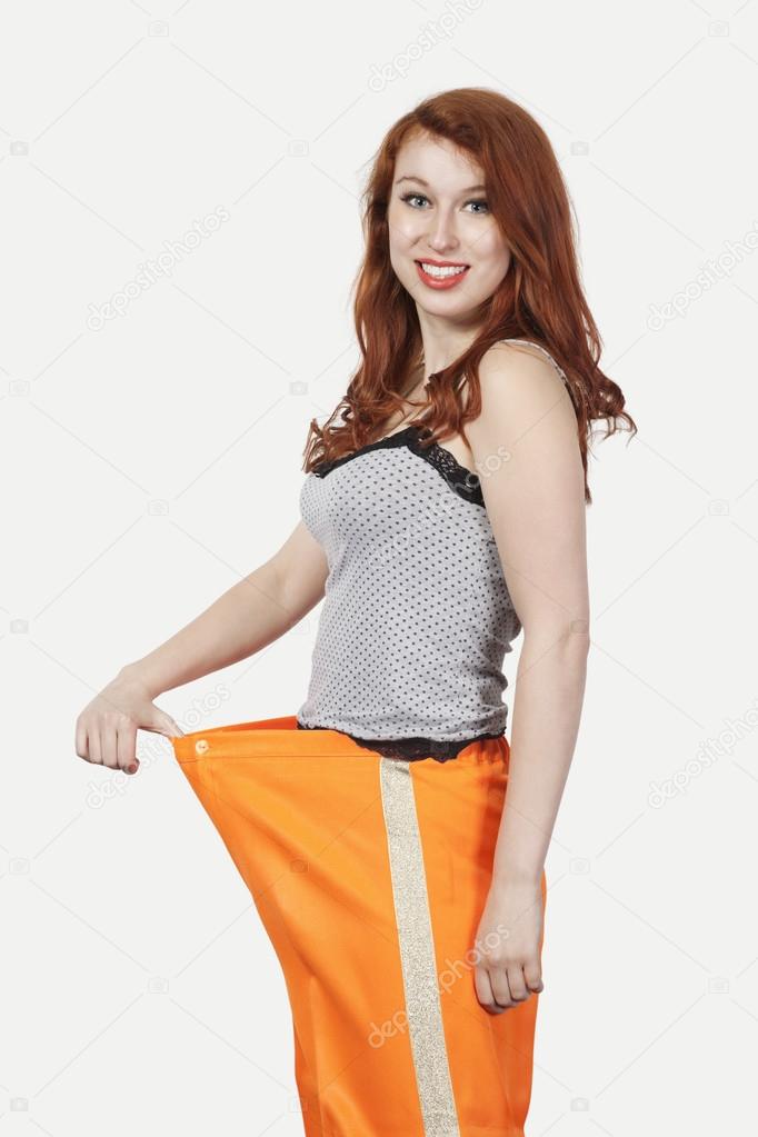 Woman oversized orange pants