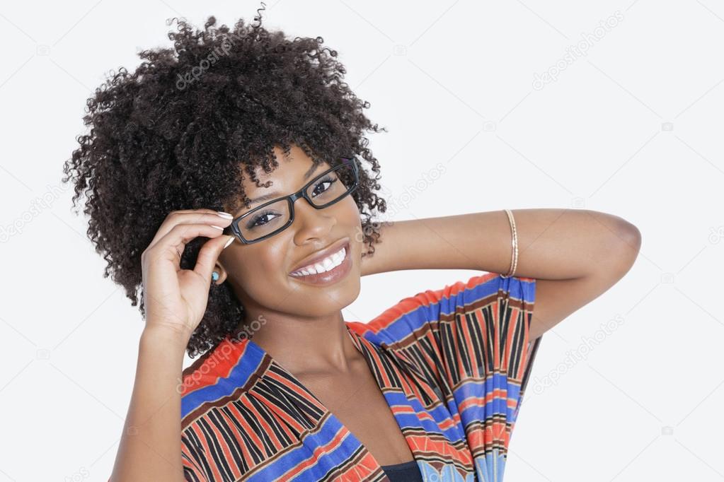 Woman in African print attire wearing glasses