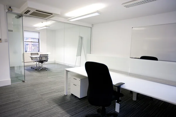 Office desk with meeting room — Stock Photo, Image