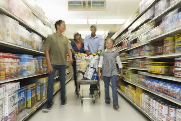 Family shopping in supermarket — Stock Photo, Image