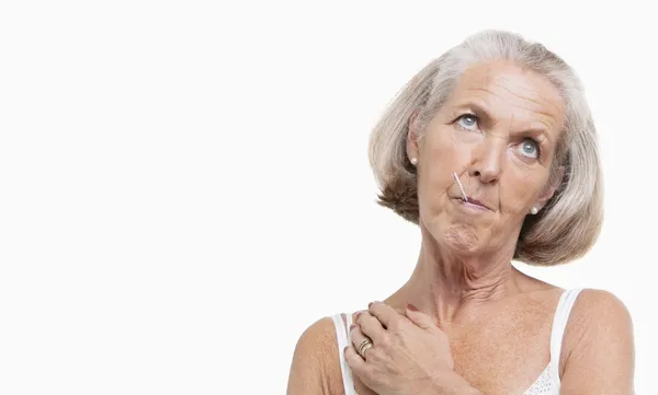 Unwell senior woman with thermometer — Stock Photo, Image