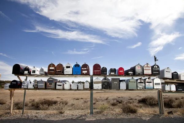 Rows of mailboxes in desert — Stock Photo, Image