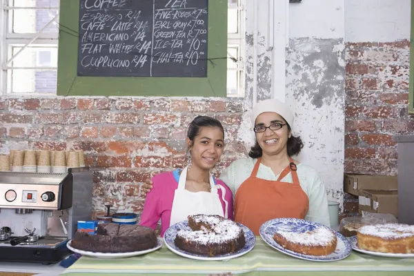 Catering assistants stand in service area — Stock Photo, Image