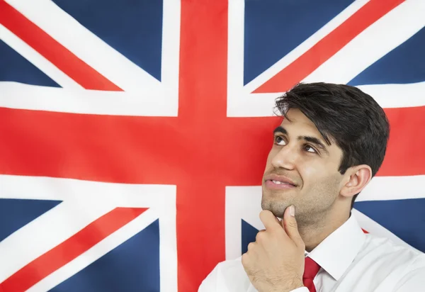 Homem contra bandeira britânica — Fotografia de Stock