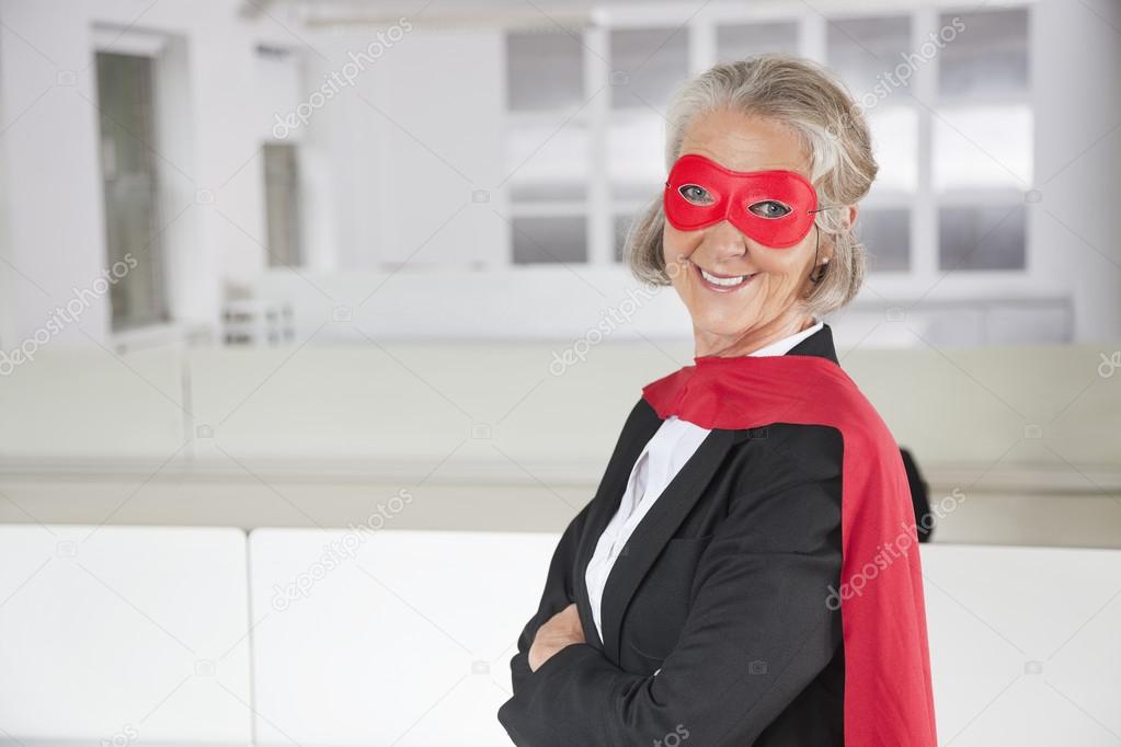 Senior businesswoman in superhero costume