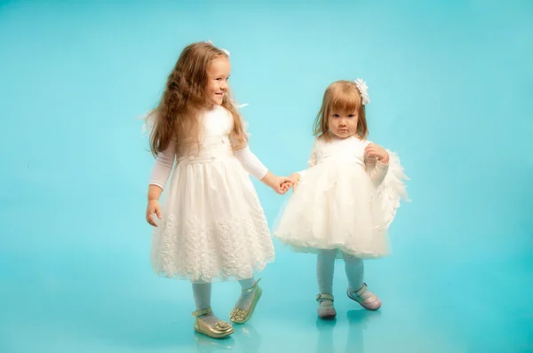 Cute little girls in white dresses — Stock Photo, Image