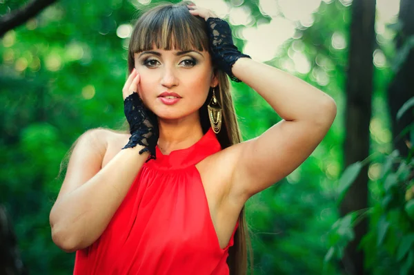 Portrait of a sensual woman in a red dress — Stock Photo, Image