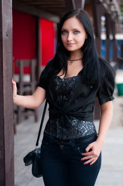 Beautiful brunette in black — Stock Photo, Image