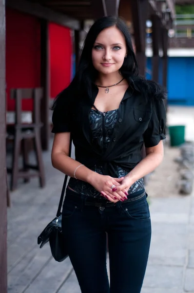 Beautiful brunette in black — Stock Photo, Image