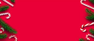 Kırmızı ve beyaz çizgili çubuklar, köknar dalları sınırında. Kırmızı arka plan. Mesaj için yer var. Vektör illüstrasyonu.