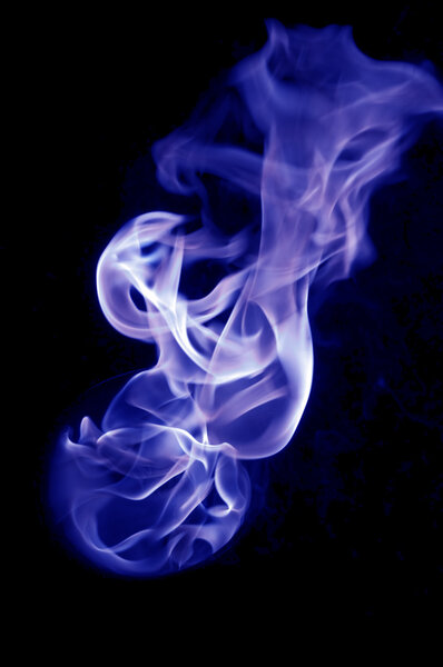 Bluish fire with a black background, abstract background.