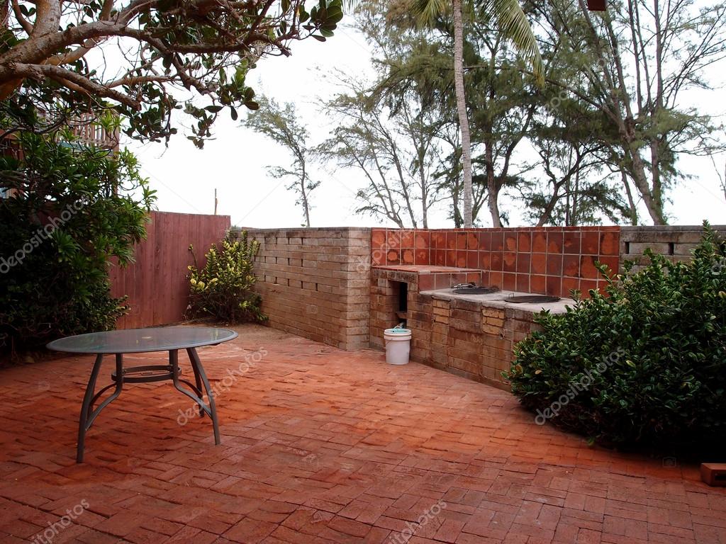 Red Brick Patio with BBQ Pits