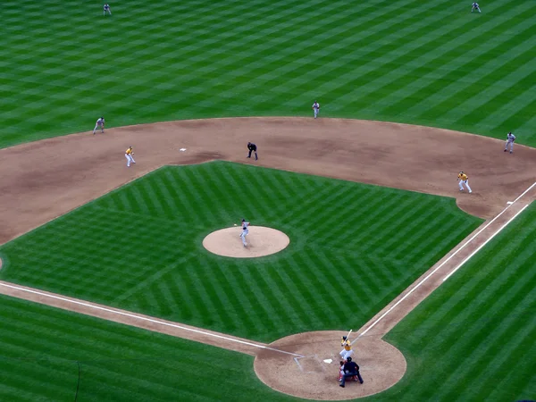 Red Sox Pitcher winds-up to throw as A's runners taking leads a — Stock Photo, Image