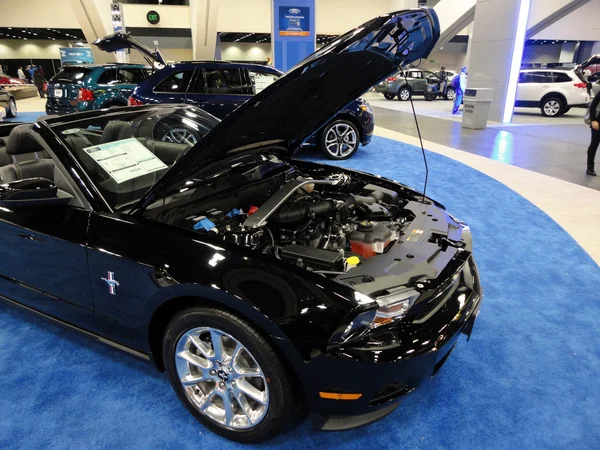 Black Ford Mustang displayed with hood open — Stock Photo, Image