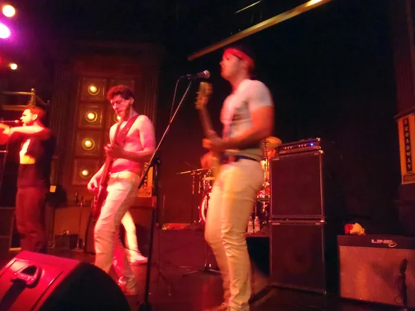 Guitar players jams as Strong Like Bull plays music on stage