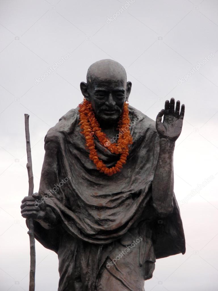 Statue of Ghandi wearing an orange lei