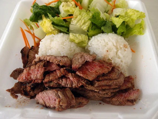 Steak, White Rice, toss salad in a styrofoam plate — Stock Photo, Image