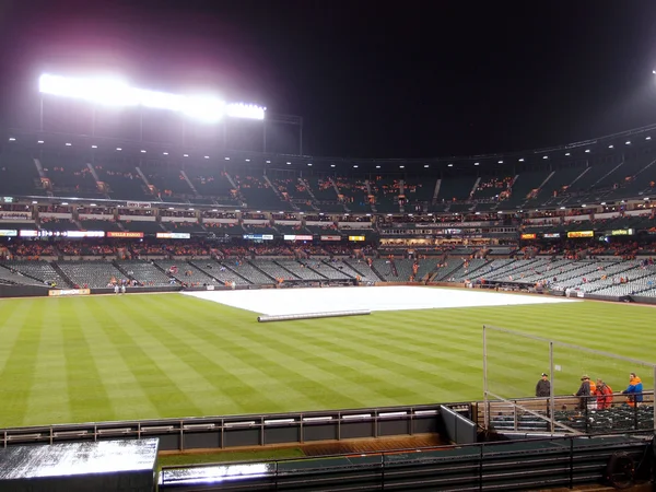 Tarp to cover infield to save it from rain during rain delay — Stock Photo, Image