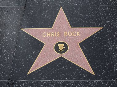 Hollywood, California - October 16, 2019: Comedian Chris Rock star with Movie Logo on Hollywood Walk of Fame. This star is located on Hollywood Blvd. and is one of 2700 celebrity stars.