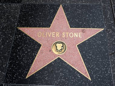 Hollywood, California - October 16, 2019: Director Oliver Stone star with Movie Logo on Hollywood Walk of Fame. This star is located on Hollywood Blvd. and is one of 2700 celebrity stars.