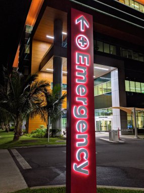 Honolulu - December 7, 2019: Emergency Sign in front of Kapiolani Medical Center for Women and Children at night. 
