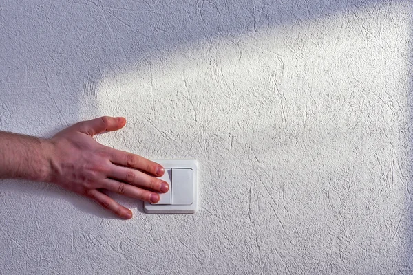 Turning light switch — Stock Photo, Image