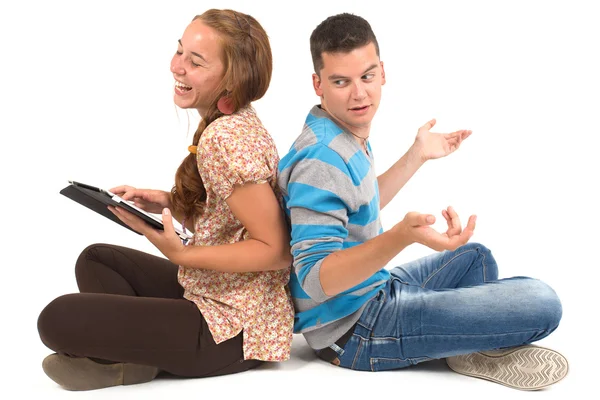 Chica joven y niño con la tableta — Foto de Stock