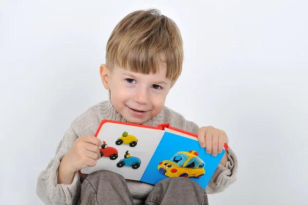 Menino com um livro — Fotografia de Stock