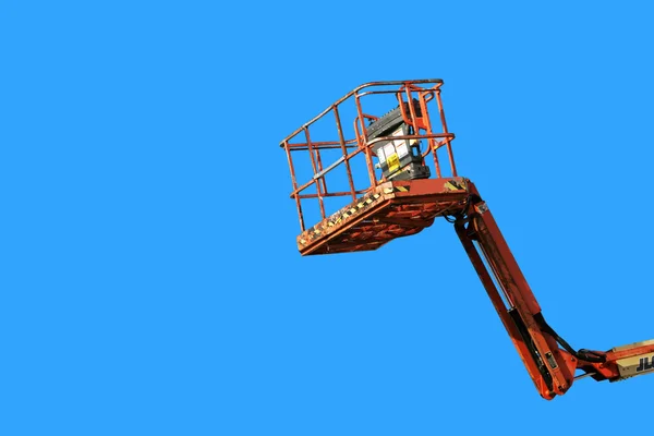 Cherry picker on blue — Stock Photo, Image