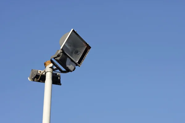 Security light against a blue sky — Stock Photo, Image