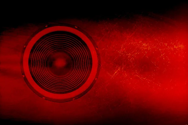 Speaker on a red grunge background — Stock Photo, Image